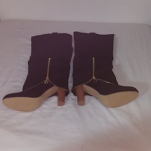 Black side zipper knee high 4" stacked heel boots.